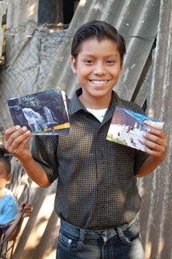 boy holding up cards