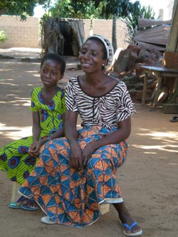 woman and girl sitting together