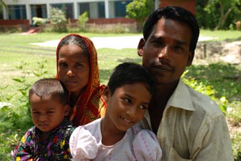 man and woman and two children