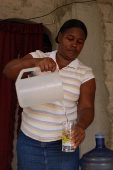 woman pouring water from pitcher