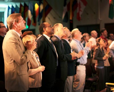 group of men and women gathered in a church