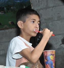 boy brushing his teeth