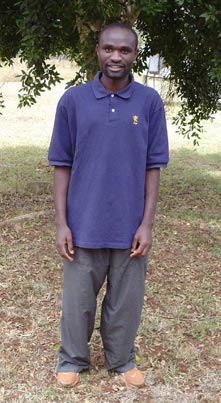 man standing in front of tree