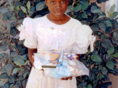 young girl holding gifts
