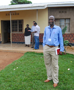 Rwandan man standing in front of building