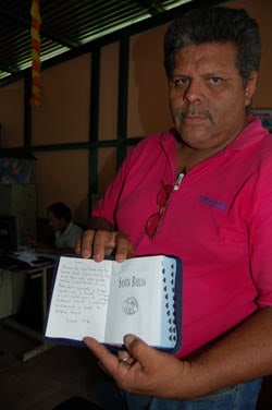 man holding an open bible