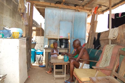 man and a child inside a home