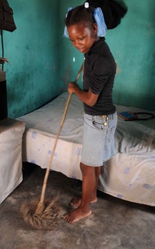 boy mopping floor