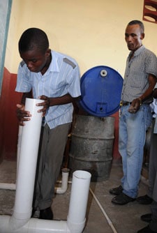 man and boy working with PVC