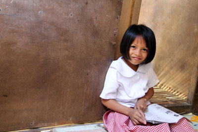 Young girl reading a book.