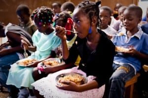 seated children having a meal