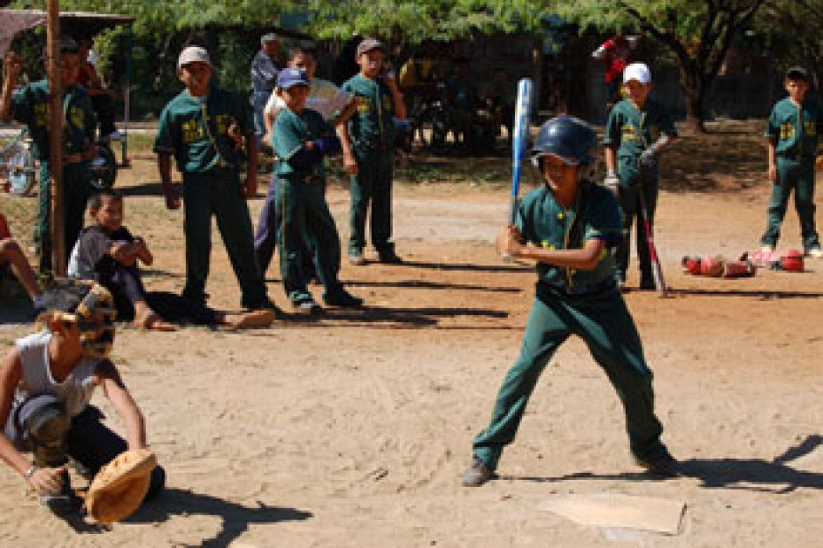 A batter and catcher near home plate