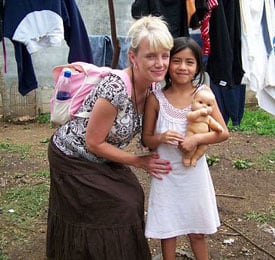 Debbi Akers with child holding doll