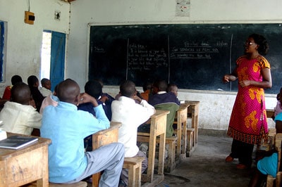 woman teaching young people in a classroom