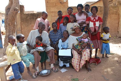 large family sitting outside