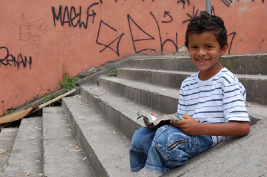 young boy sitting on steps