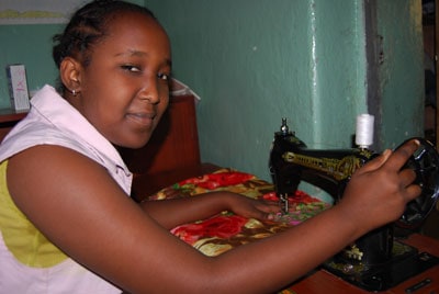 girl using sewing machine