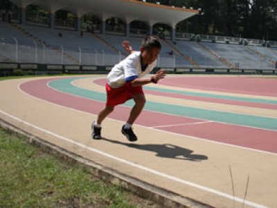 boy running on track