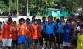 A group of children wearing soccer jerseys