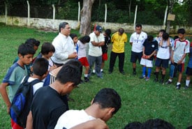 soccer players praying