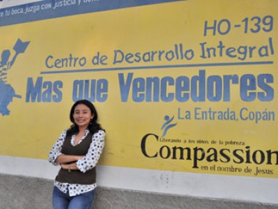 Vilma Canales in front of sign