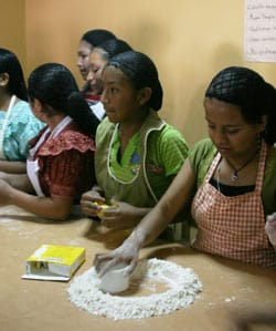 girls learning how to bake