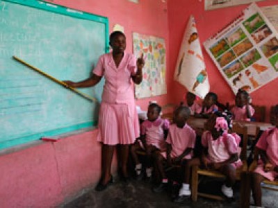 woman teaching young children in classroom