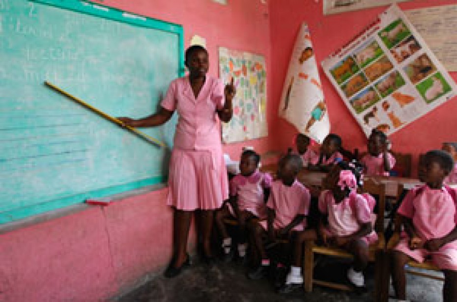 woman teaching young children in classroom