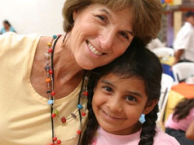 woman and young girl smiling for camera
