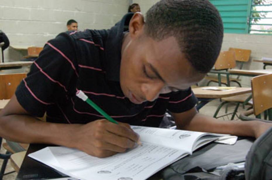 boy writing in a notebook