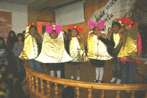 group of children in costumes for a Christmas program