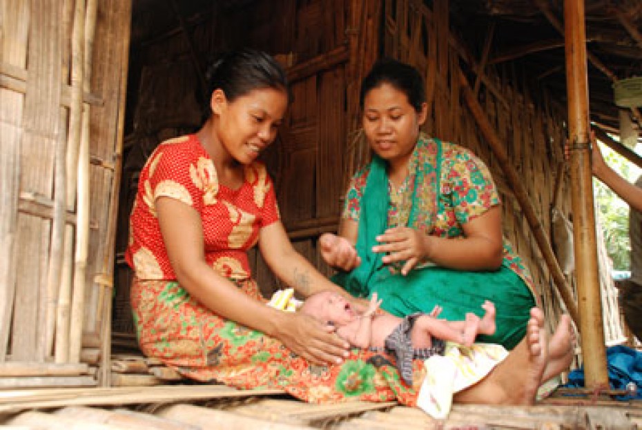 two women with a baby