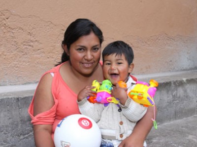 woman holding young boy on lap