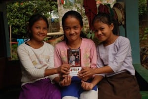 three girls holding sponsors photo