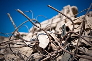 picture of broken concrete and bent twisted rebar