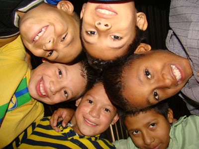 group of children looking down at camera