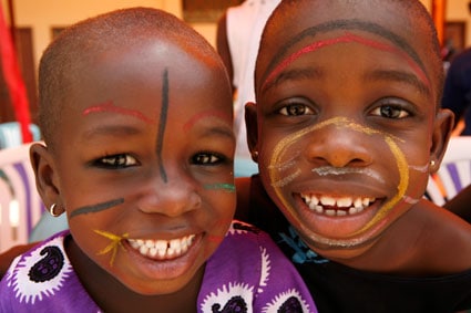 two smiling boys with faces painted