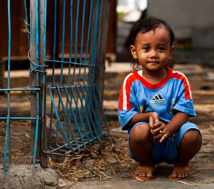 young child wearing blue outfit