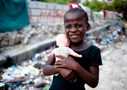 girl holding doll