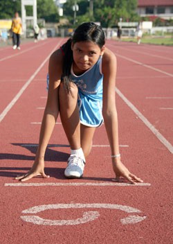 young lady at running track