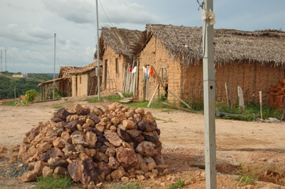 houses with mud walls and thatched roofs