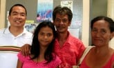 Filipino girl with parents and pastor