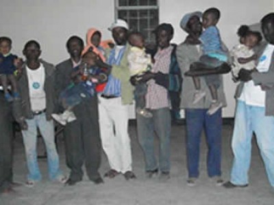 group of Ethiopian men holding children