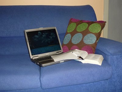 open laptop sitting on couch