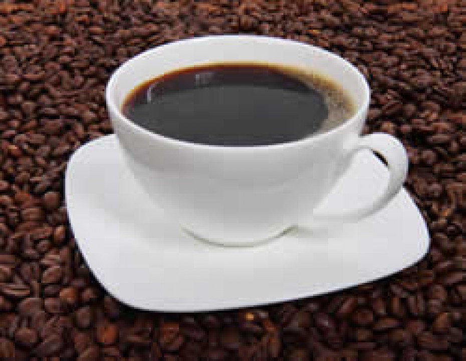 a white cup and white saucer filled with coffee