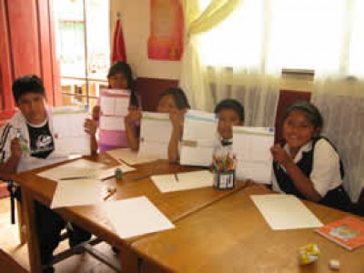 five children holding up letters