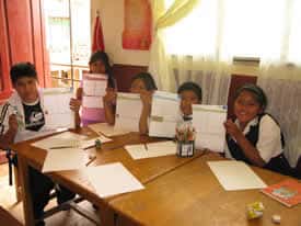 children holding up letters