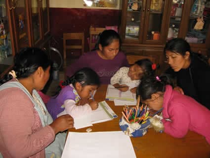 group of children writing letters