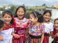 A group of girls in colorful, traditional dress in Guatemala.