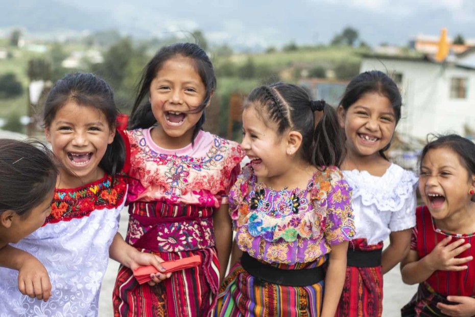 A group of girls in colorful, traditional dress in Guatemala.